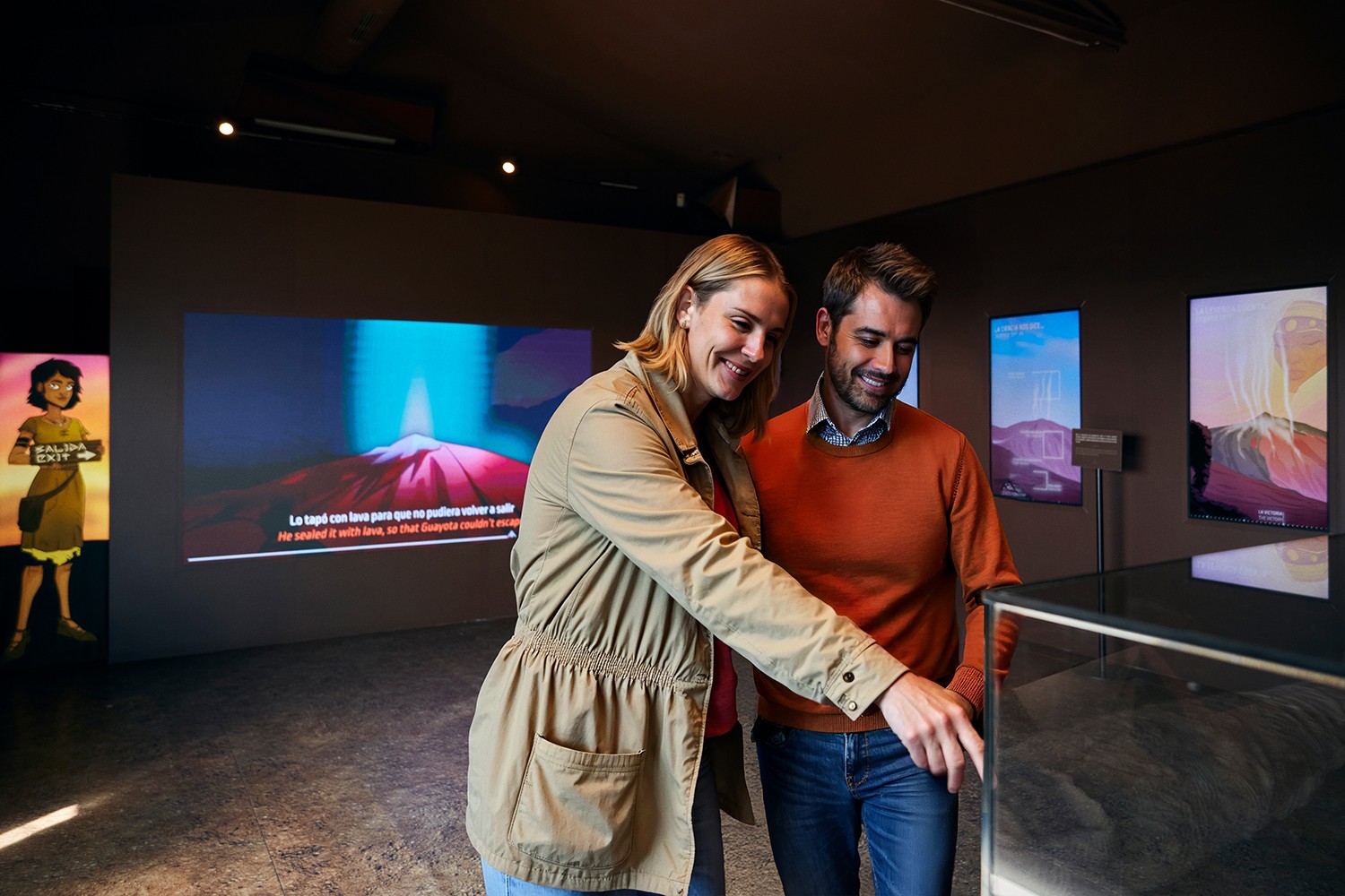 Couple exploring the Teide Legend exhibition dedicated to Mount Teide’s history and nature.