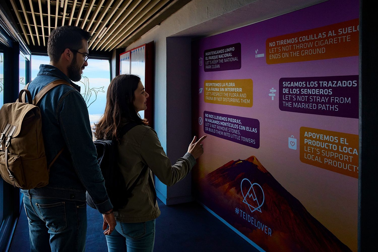 Couple visiting the Teide Legend exhibition at the Teide cable car upper station.