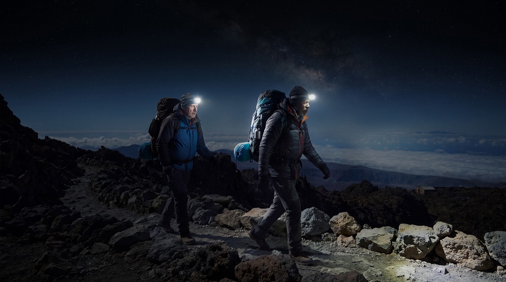 Group of people enjoying the starry night at the refuge on Mount Teide
