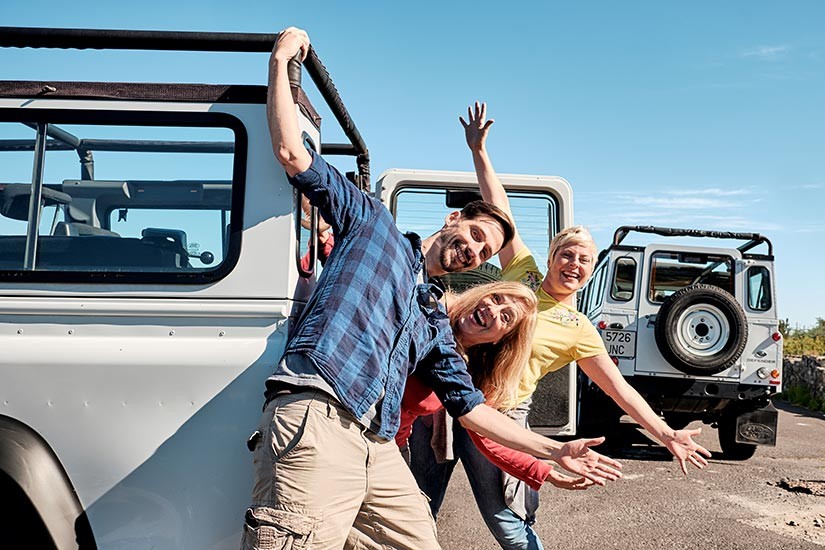 Young people in front of the jeeps on the Jeep Safari excursion