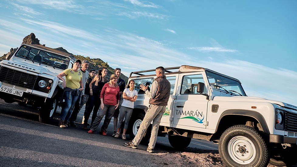 Excursionists and a guide on the private Jeep Safari to Teide